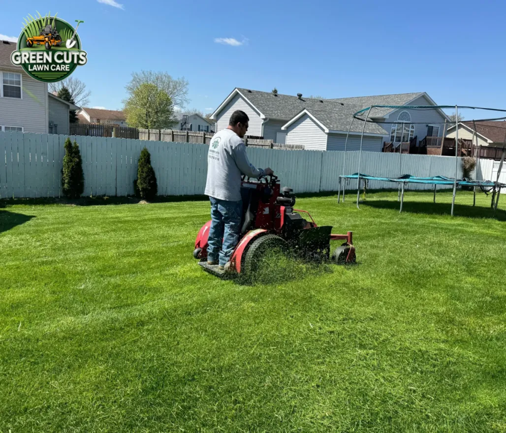 Staples Lawn Care crew mowing a lawn in Alabama